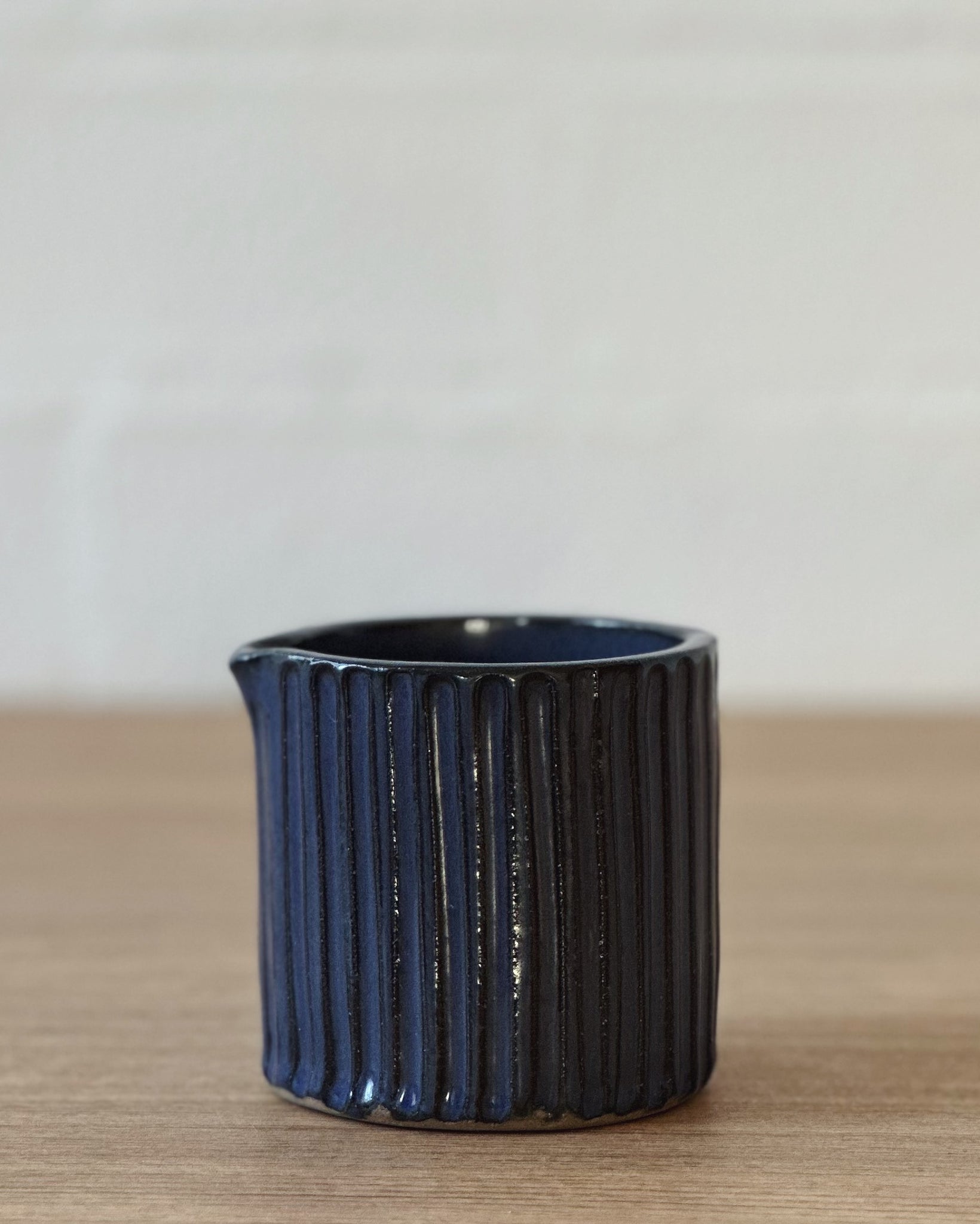 Carved dark denim blue jug