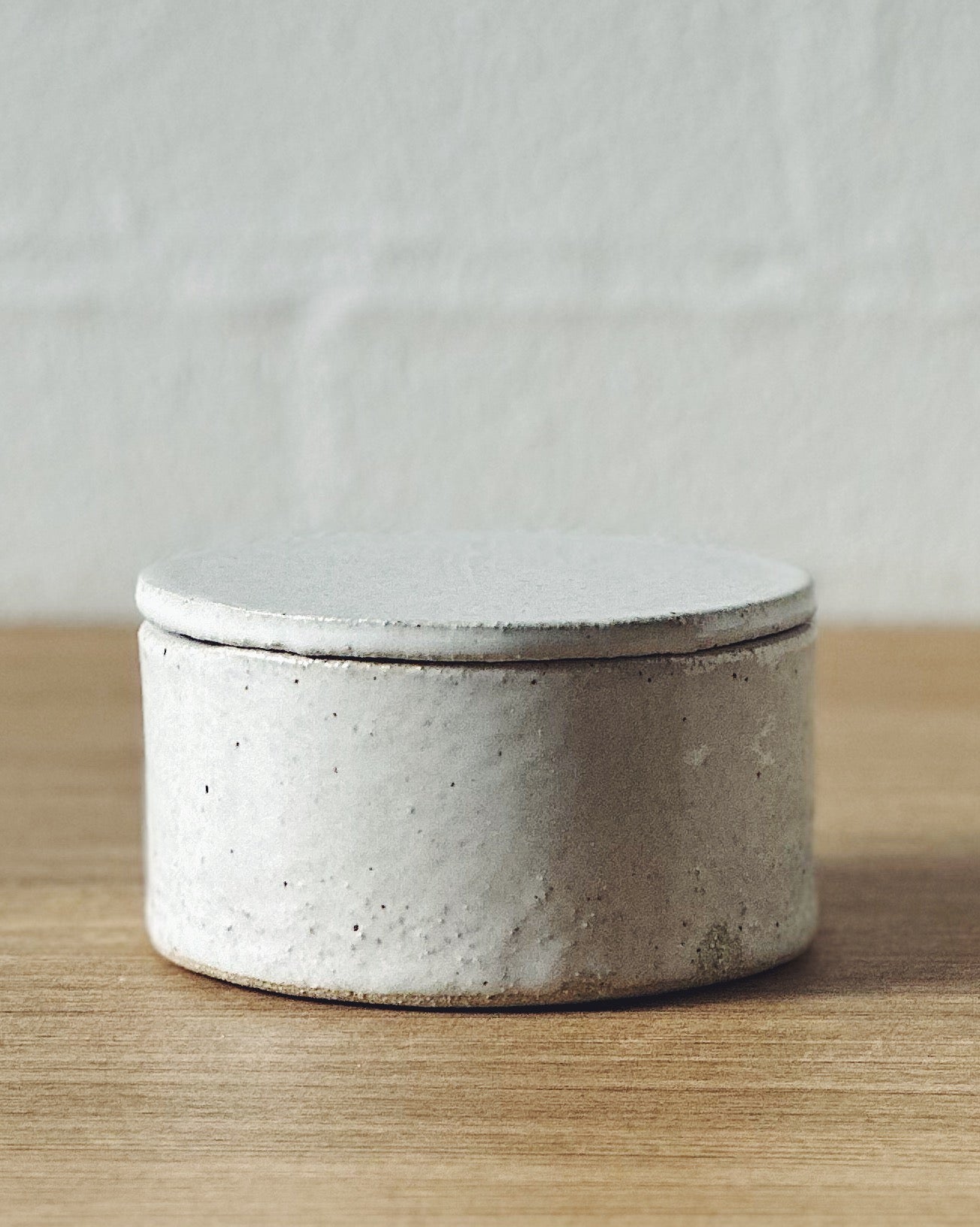 white lidded container