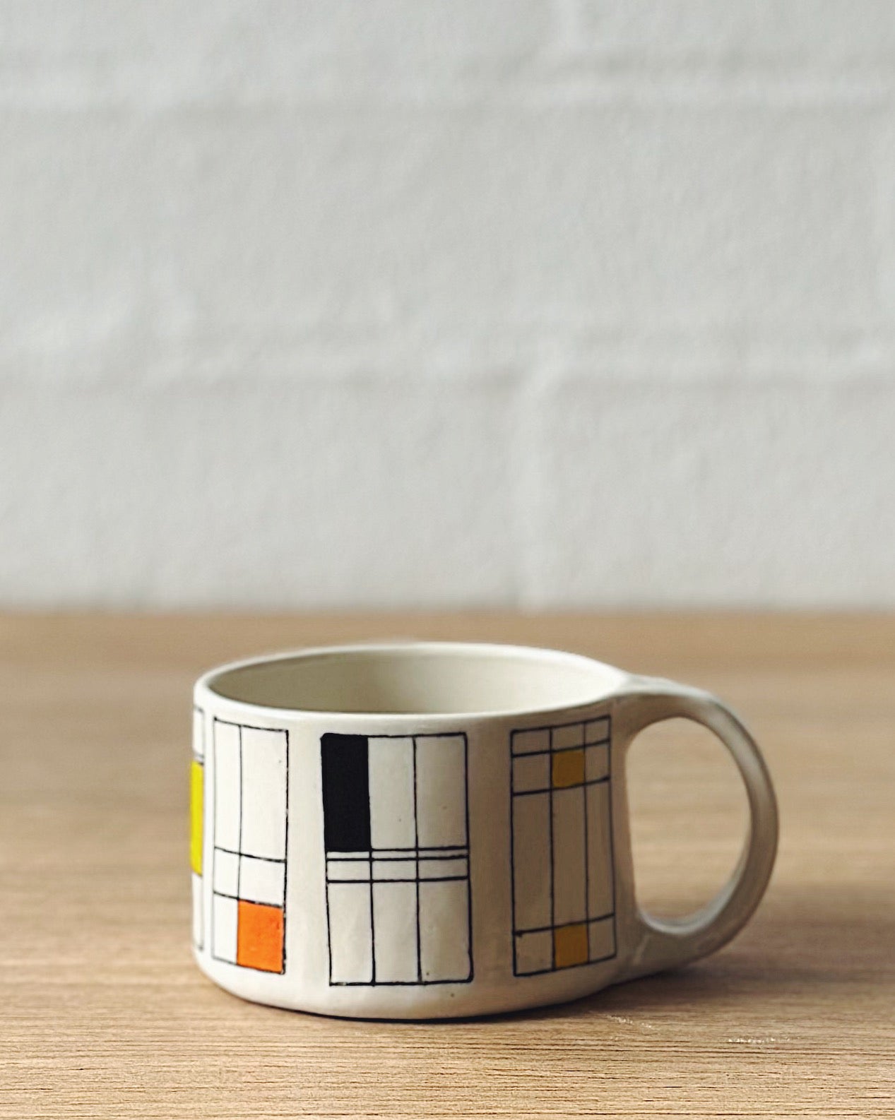 Mondrian mug (black, yellow and orange) - short