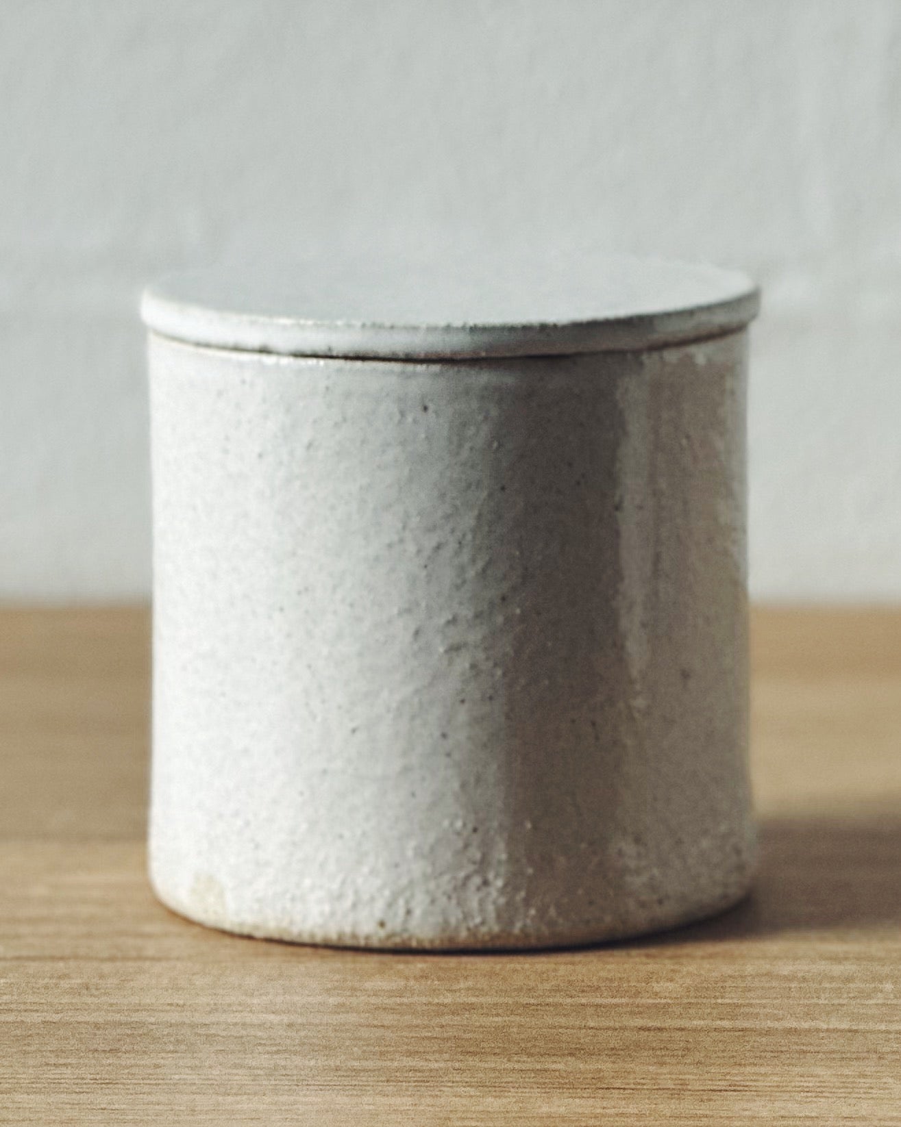 white lidded container