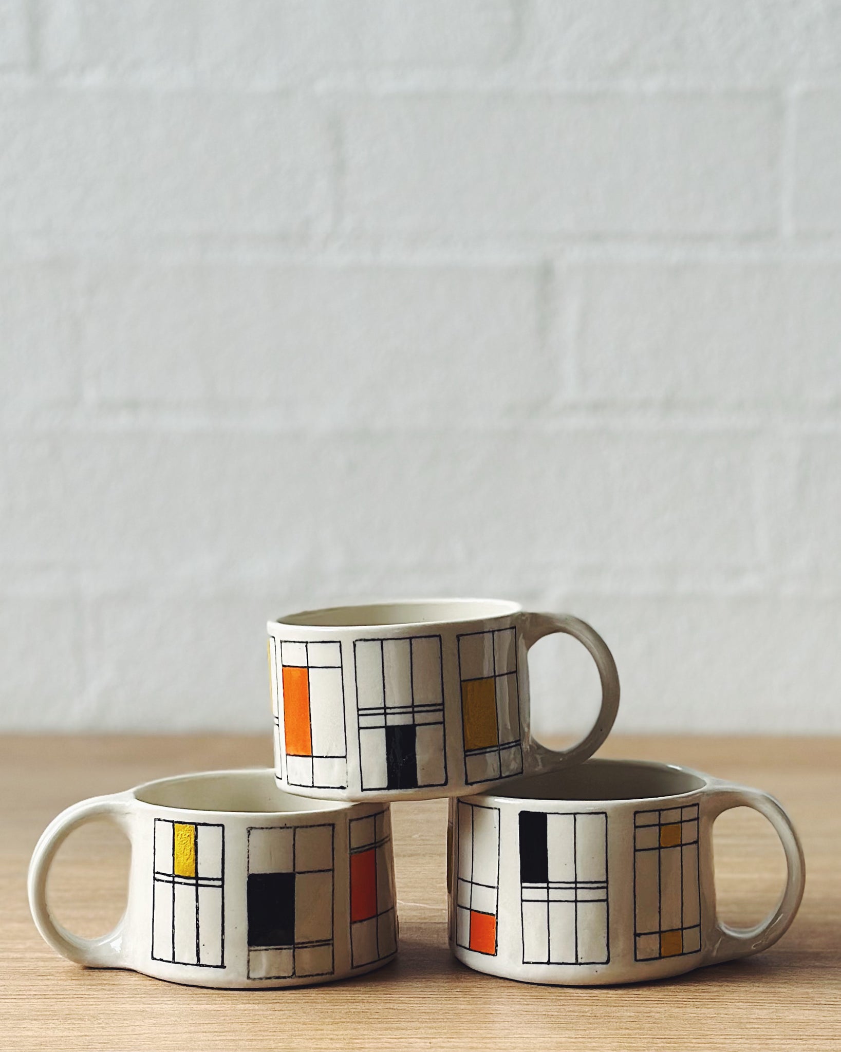 Mondrian mug (black, yellow and orange) - short