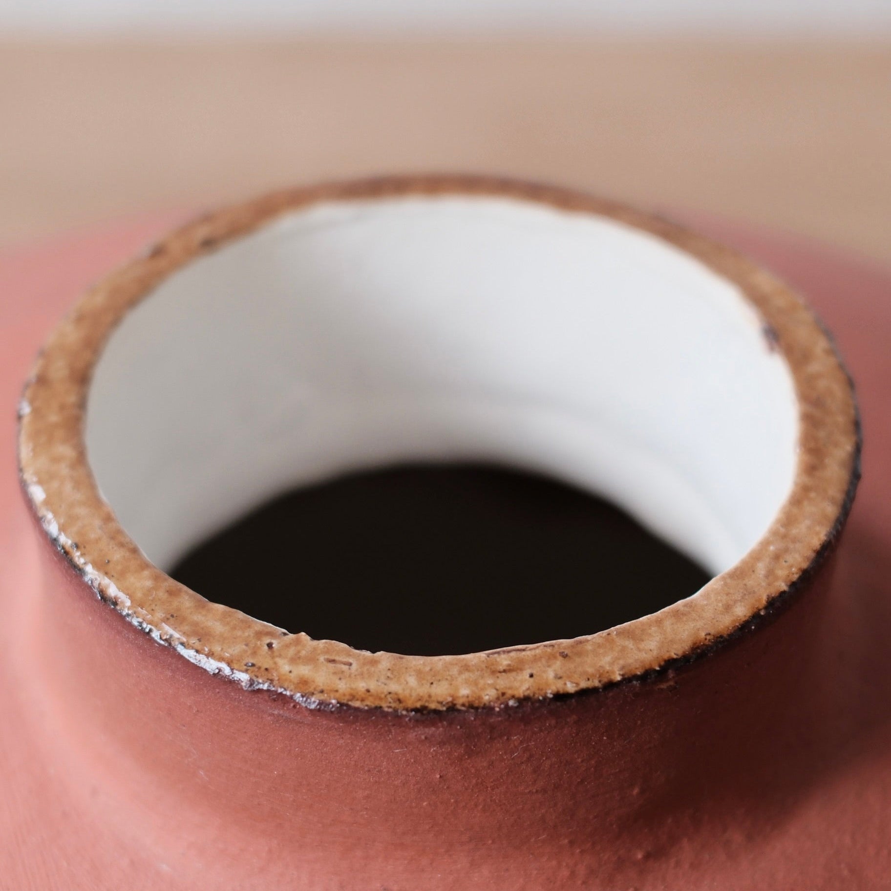 Close-up of a ceramic vessel with white interior