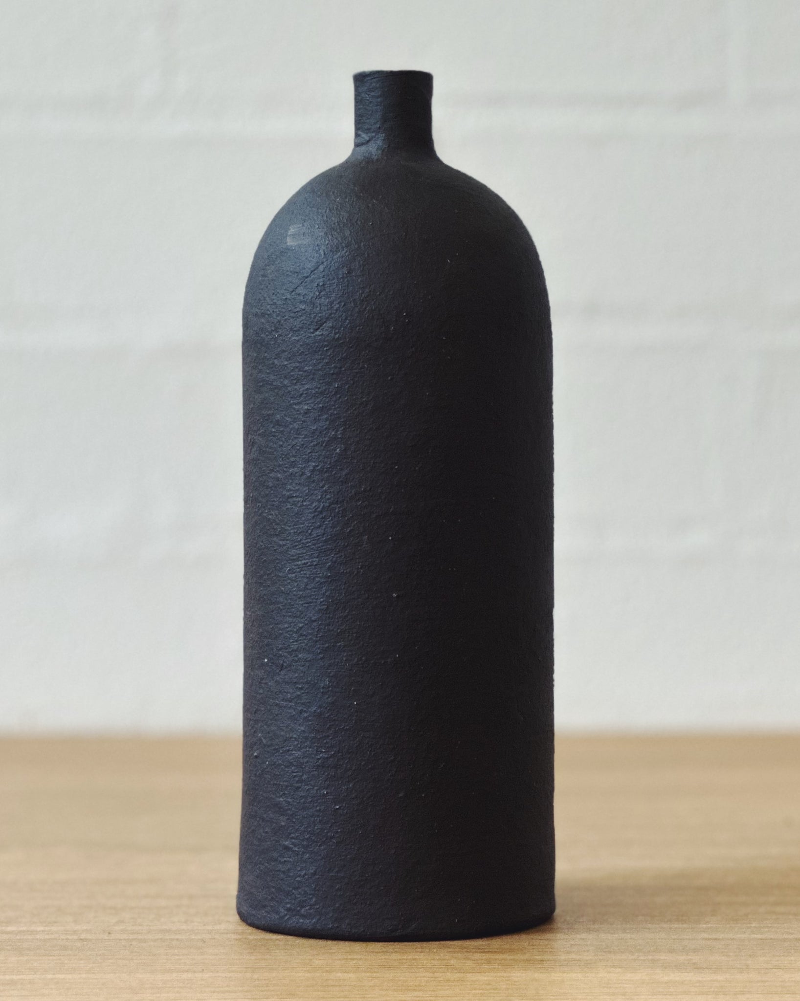 black vaseUP bottle